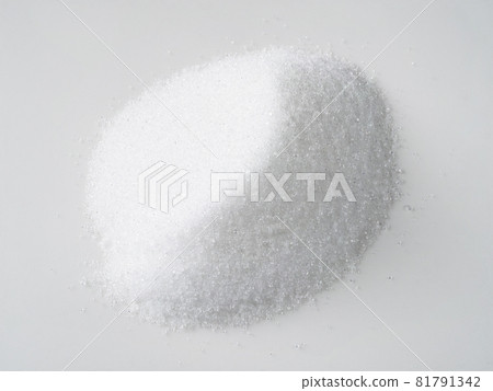 pile of crystalline extract of stevia plant sugar substitute closeup on white plate pile of crystalline extract of stevia plant sugar substitute closeup on white plate 81791342