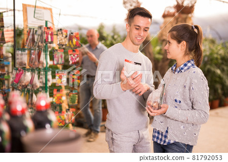 Husband and wife shop at garden store 81792053