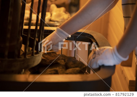 the hands of the master lay stones in the sauna stove the hands of the master lay stones in the sauna stove 81792129