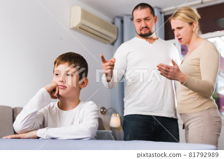 Upset boy scolded by parents 81792989