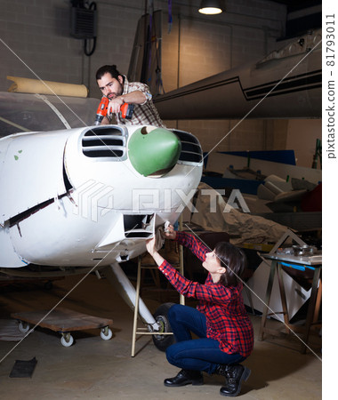 Amateurs restoring sports plane Amateurs restoring sports plane 81793011