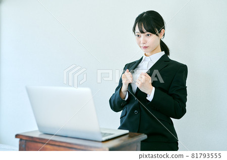 A woman grooming for an online interview 81793555