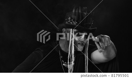 Man in skeleton Halloween cosplay costume. Guy in creepy skull makeup making faces, looks mysterious Man in skeleton Halloween cosplay costume. Guy in creepy skull makeup making faces, looks mysterious 81795501