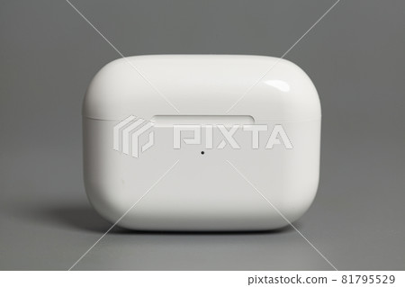 Wireless earphones charging case on grey background Wireless earphones charging case on grey background 81795529