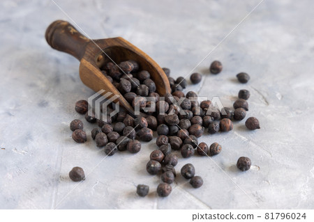 Black chickpea on the wooden scoop closeup Black chickpea on the wooden scoop closeup 81796024