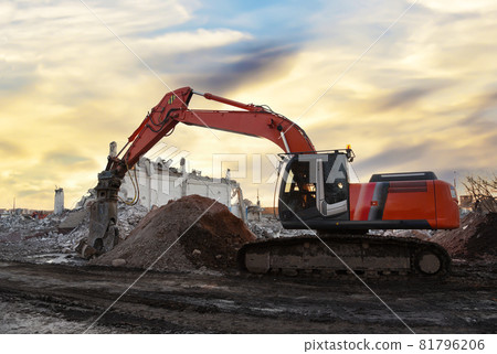Excavator with attachment for demolishing and recycling concrete. Crushers tool and Demolition Excavator with attachment for demolishing and recycling concrete. Crushers tool and Demolition 81796206