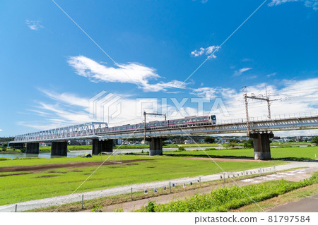 Keio Line train walk seen from the Tama River cycling road Summer blue sky and clouds Chofu City, Tokyo Keio Line train walk seen from the Tama River cycling road Summer blue sky and clouds Chofu City, Tokyo 81797584