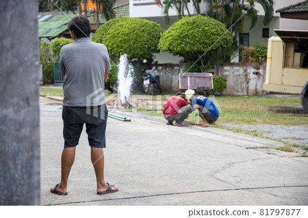 failure of the water supply system. craftsmen repair water pipes on the street 81797877