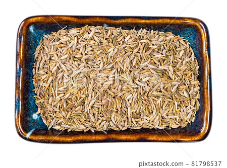 top view of cumin fruits in ceramic bowl cutout on white background top view of cumin fruits in ceramic bowl cutout on white background 81798537