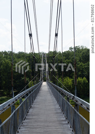 Pedestrian suspension bridge over river Neman 81798602
