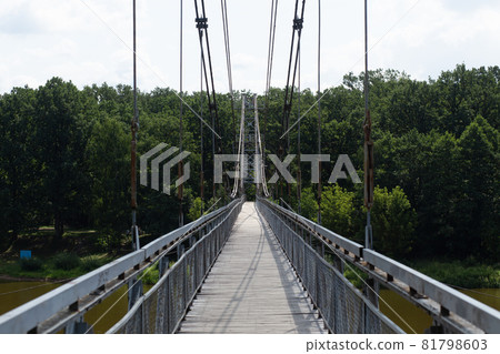 Pedestrian suspension bridge over river Neman 81798603