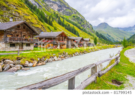 Old rural wooden houses in alpine valley Old rural wooden houses in alpine valley 81799145