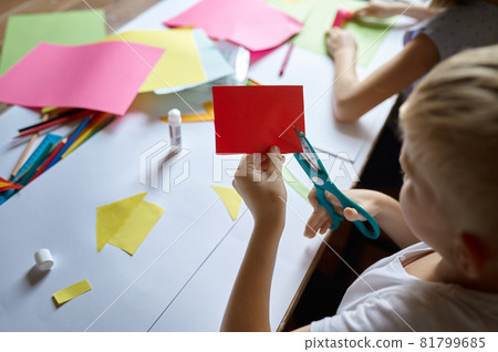 Children cut colored paper, kids in art school 81799685