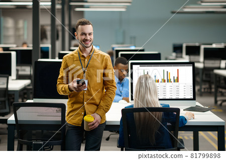 Team of managers at their workplaces in IT office Team of managers at their workplaces in IT office 81799898