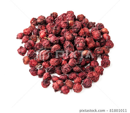 pile of dried magnolia berries (Schisandra Chinensis seeds) closeup on white background 81801011