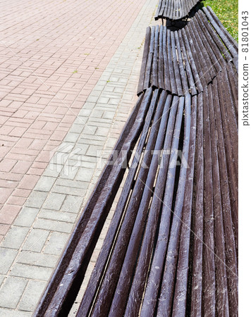 empty shabby long brown wooden benches in city park empty shabby long brown wooden benches in city park 81801043