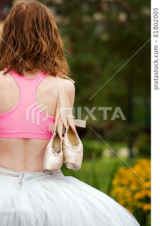 Unrecognizable ballet dancer in city street Unrecognizable ballet dancer in city street 81802005