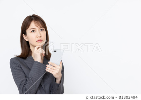 Business woman smartphone thinking 81802494