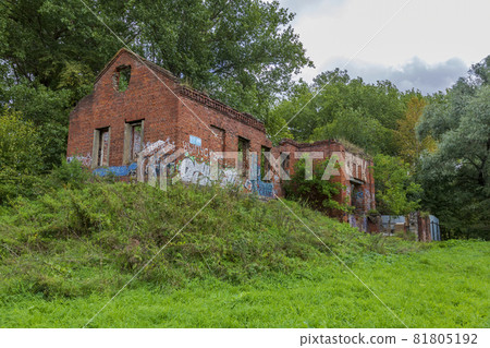 Facade of an abandoned brick building of a water pumping station in a city park Facade of an abandoned brick building of a water pumping station in a city park 81805192