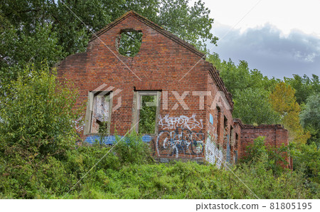 Facade of an abandoned brick building of a water pumping station in a city park Facade of an abandoned brick building of a water pumping station in a city park 81805195