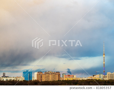 large rainy cloud over residential district at spring sunset in Moscow city 81805357
