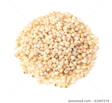 pile of raw Sorghum groats closeup on white background 81805374