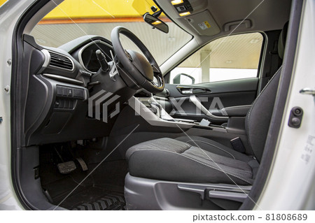 empty interior of modern premium car. black interior, driver's seat 81808689