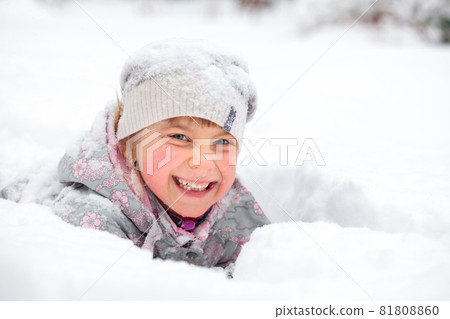 Child enjoying a wintertime Child enjoying a wintertime 81808860