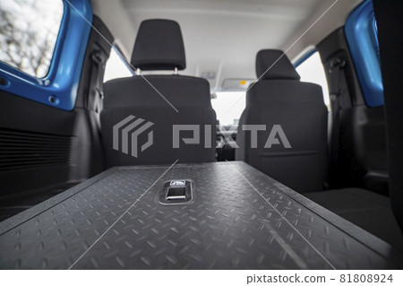 folded rear seats in car, rear view close up 81808924