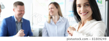 Group of business people are sitting at conference with documents in hand Group of business people are sitting at conference with documents in hand 81809249