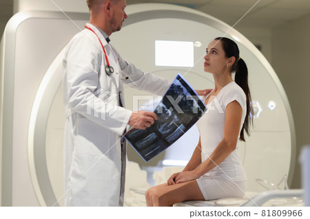 Male doctor explaining to female patient result of MRI examination in clinic Male doctor explaining to female patient result of MRI examination in clinic 81809966