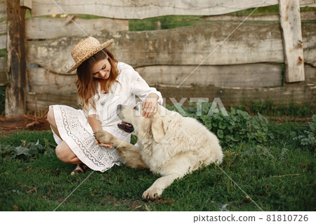 Portrait of a woman with her beautiful dog Portrait of a woman with her beautiful dog 81810726