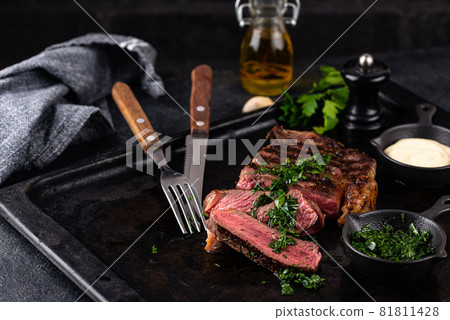 Grilled marbled rib eye steak 81811428