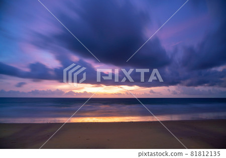 Long exposure Colorful sky sunset or sunrise Burning colourful sky and shining waves crashing on sandy shore Beautiful light reflection on sea surface Amazing landscape or seascape nature background Long exposure Colorful sky sunset or sunrise Burning colourful sky and shining waves crashing on sandy shore Beautiful light reflection on sea surface Amazing landscape or seascape nature background 81812135