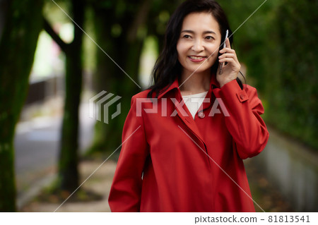 A woman in a coat A woman in a coat 81813541