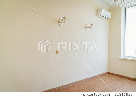classic sconces and split system on the wall in the apartment. classic sconces and split system on the wall in the apartment. 81815935