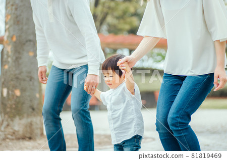 Families walking hand in hand Families walking hand in hand 81819469