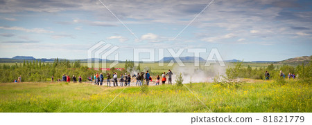 Geysir, Iceland - July 28, 2021: Geyser Strokkur in iceland errupting with hot water and steam, each year many tourists visit the geyser located in the golden circle Geysir, Iceland - July 28, 2021: Geyser Strokkur in iceland errupting with hot water and steam, each year many tourists visit the geyser located in the golden circle 81821779