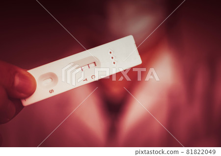 Antigen test for Covid or Pregnancy show visible line at Test position for detected or positive result red color tone. 81822049