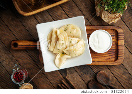 Russian vareniki dumplings with sour cream 81822654