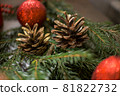 Christmas balls and decorations over festive background. Christmas holiday celebration concept 81822732