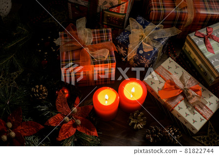 Christmas decoration with christmas bauble and candle for advent season four candles burning on dark 81822744