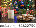 Gingerbread cookies on wood table with milk. Christmas holiday background. 81822750