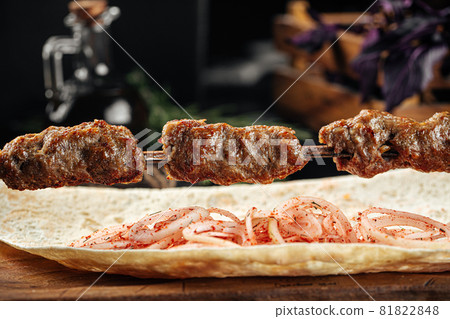 Caucasian beef lyulya kebab with marinated onion Caucasian beef lyulya kebab with marinated onion 81822848