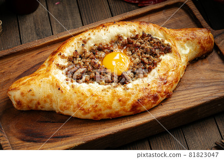 Georgian adjarian khachapuri with egg and mince 81823047