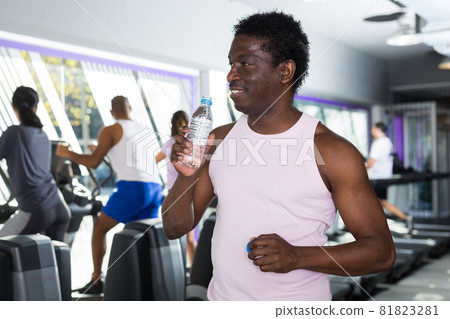 Man resting after workout with still water Man resting after workout with still water 81823281