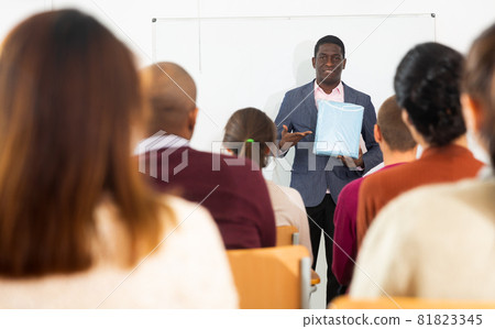 African american coach businessman giving talk at modern office conference to multiethnic team 81823345