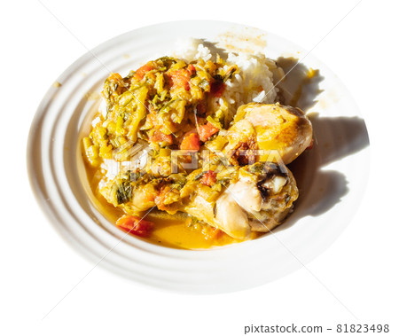 portion of Chakhokhbili (traditional georgian dish from stewed chicken meat, tomato, eggplant and fresh herbs) with boiled rice on white plate illuminated by sun cutout on white background portion of Chakhokhbili (traditional georgian dish from stewed chicken meat, tomato, eggplant and fresh herbs) with boiled rice on white plate illuminated by sun cutout on white background 81823498