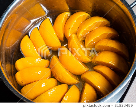 cooking of tangerine jam (varenye) in sugar syrup in stewpot on hob at home kitchen cooking of tangerine jam (varenye) in sugar syrup in stewpot on hob at home kitchen 81823499