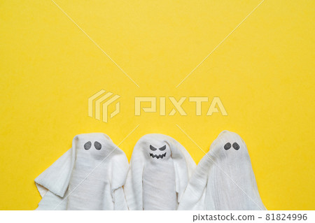 A group of ghosts with a vicious and distant look with copy space. Halloween holiday. 81824996